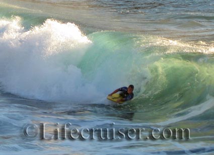 Surfer at Playa de la Arena at Tenerife Island by Lifecruiser