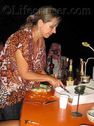 Claudie cutting the cake, France, Copyright Lifecruiser.com