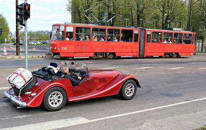 Estonia, Tallinn: red classic car and tram meet