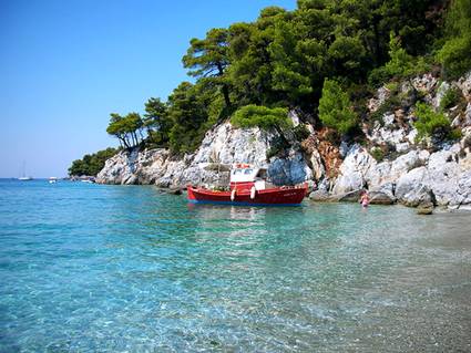Greece, Skopelos Island: Small red boat at Kastani beach