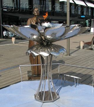 Norway, Oslo, Aker Brygge, Eternal peace flame sculpture