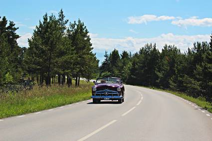 Sweden, Gotland: classic car on road
